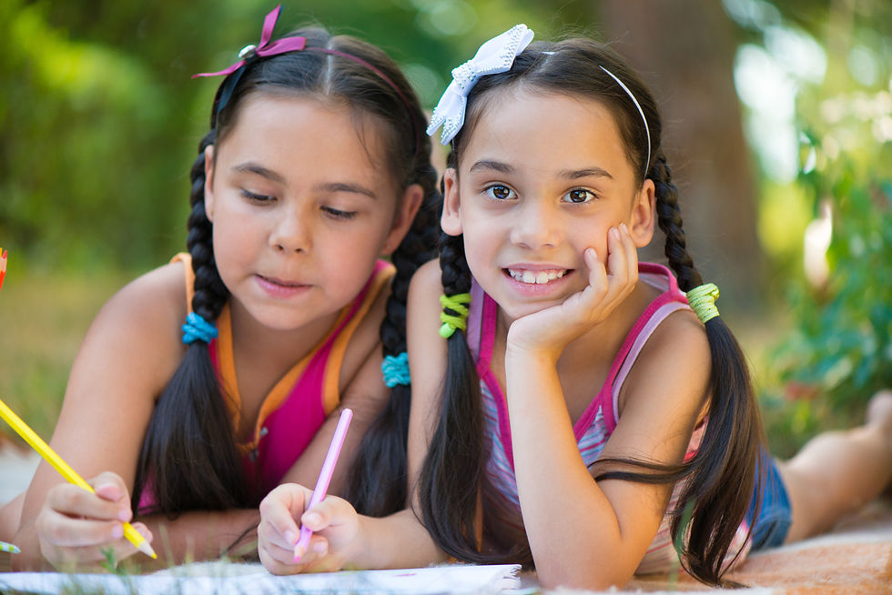 two girls outside smiling