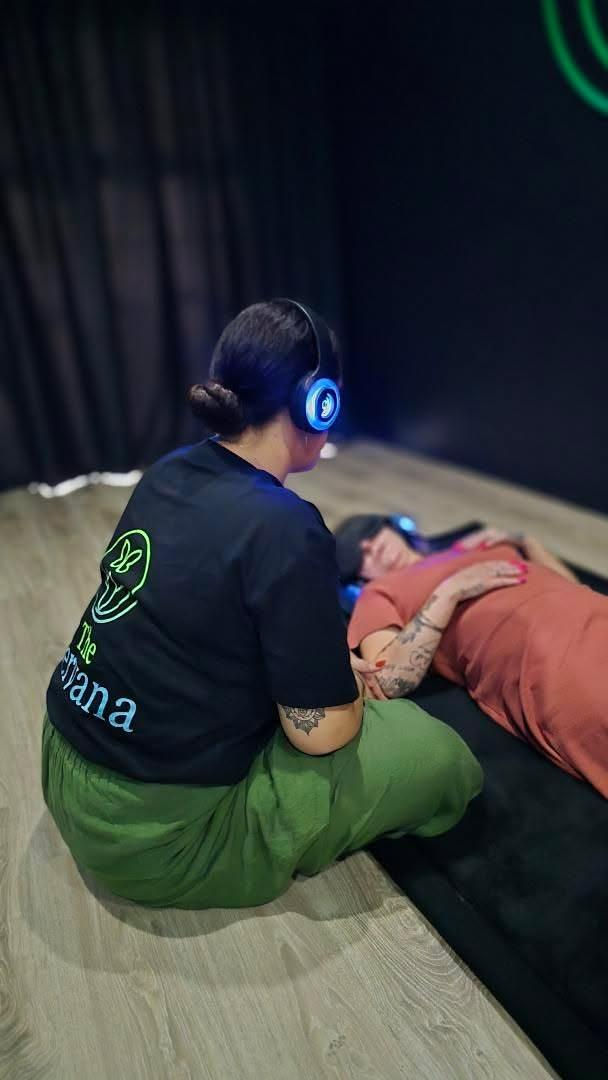 woman with headphones and eye mask on during a 9d breathwork session