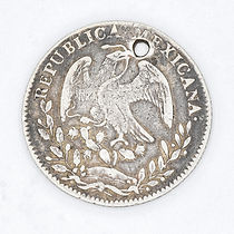 1862 8-real Mexican coin w hole.jpg