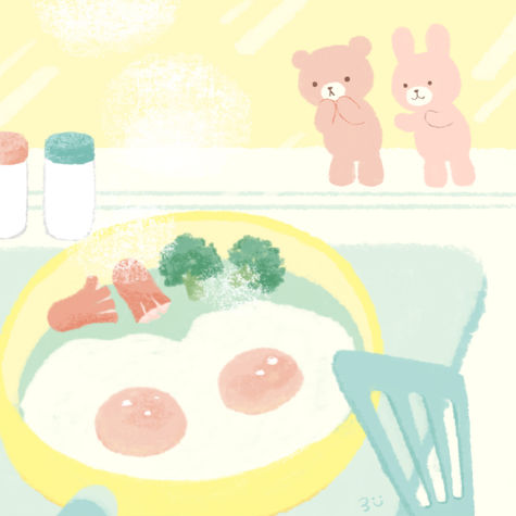 朝ごはんの目玉焼きが焼かれる様子を、くまとうさぎのぬいぐるみがガラス越しに見つめている