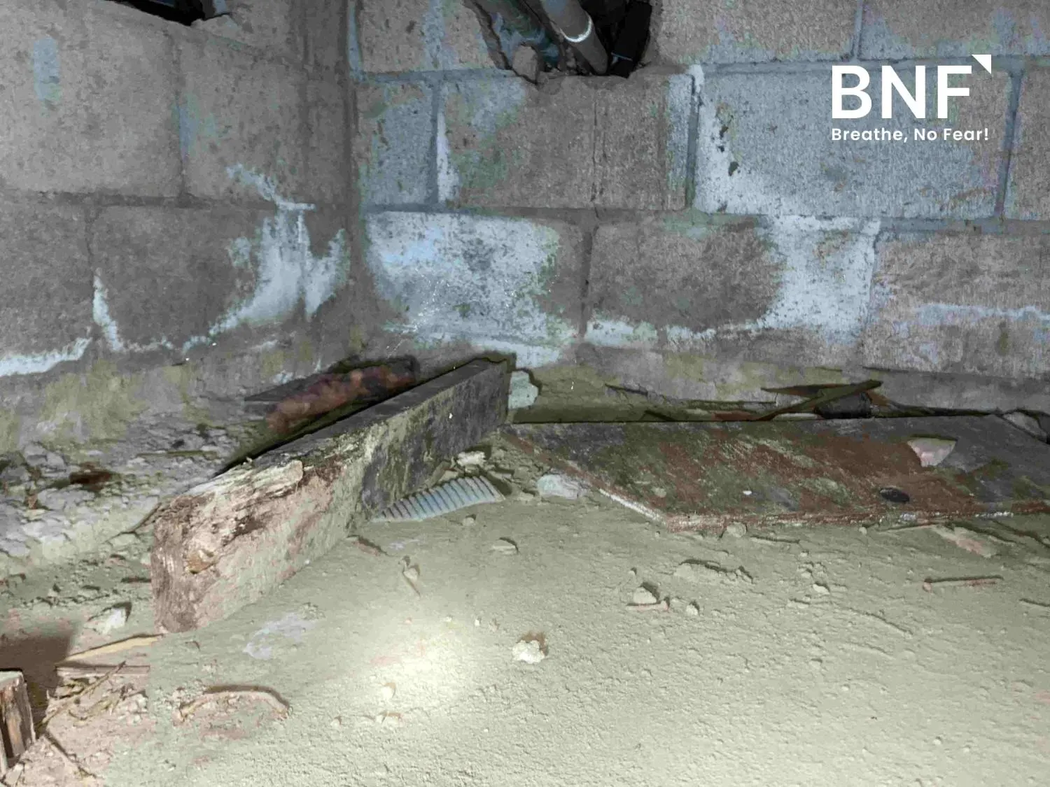Water-damaged basement floor showing potential asbestos-containing materials in Essex County, NJ, with asbestos inspection and testing provided by BNF Consulting NJ.
