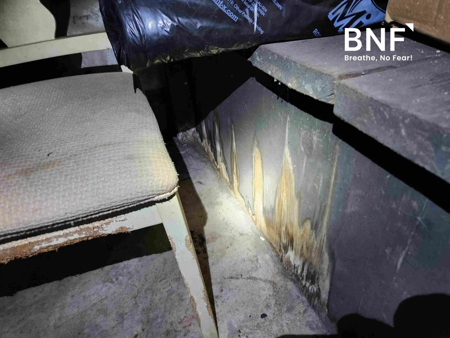 Deteriorating walls and mold growth in a basement in Passaic County, NJ, undergoing asbestos inspection and testing by a certified asbestos inspector from BNF Consulting NJ