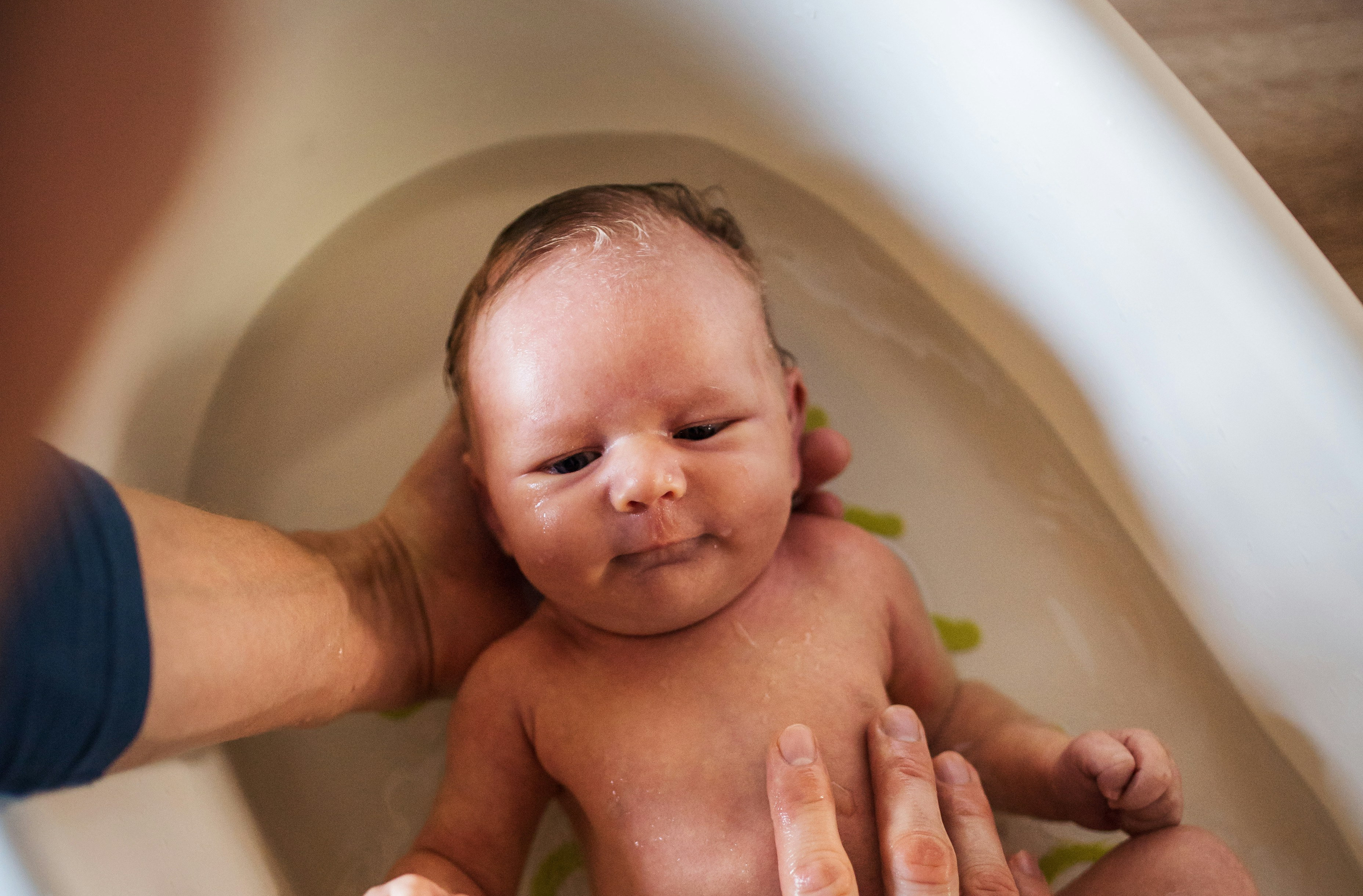 put baby in baby bath