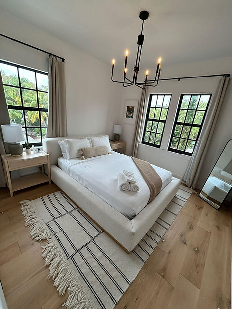 Bright and spotless Clearwater short-term rental bedroom with neatly made bed, fresh linens, and natural light — professionally prepared by Luxury STR Cleaners for Airbnb and vacation rental turnovers.