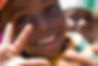 A child smiling. Africa on the Ball use football to help change lives in deprived communities in Africa. 