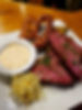 close up of a plate of mean and sauce from Summa Joe's