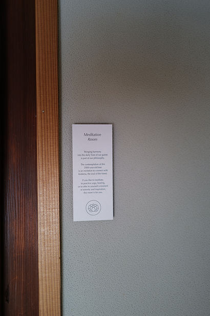 sign on green wall meditation room