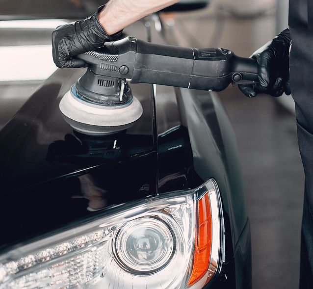 man-polish-car-garage.jpg