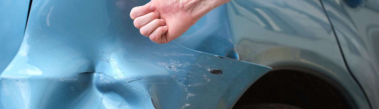 driver-hand-examining-dented-car-with-damaged-fender-parked-city-street-side-road-safety-v
