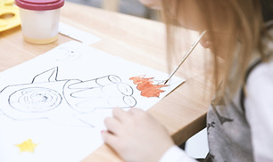 Girl Painting in Art Class