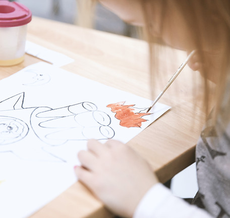 Girl Painting in Art Class