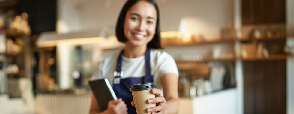 blurred-shot-young-smiling-barista-girl-giving-you-takeaway-cup-coffee-bring-you-takeout.j