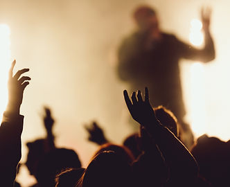dancing-concert-while-singer-is-performing-surrounded-with-lights.jpg