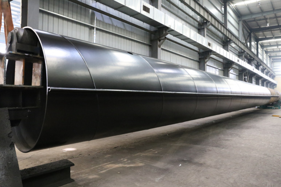 Large-diameter steel pipe pile with a protective corrosion coating applied in a fabrication facility, designed for long-term performance in marine, offshore, and infrastructure applications.