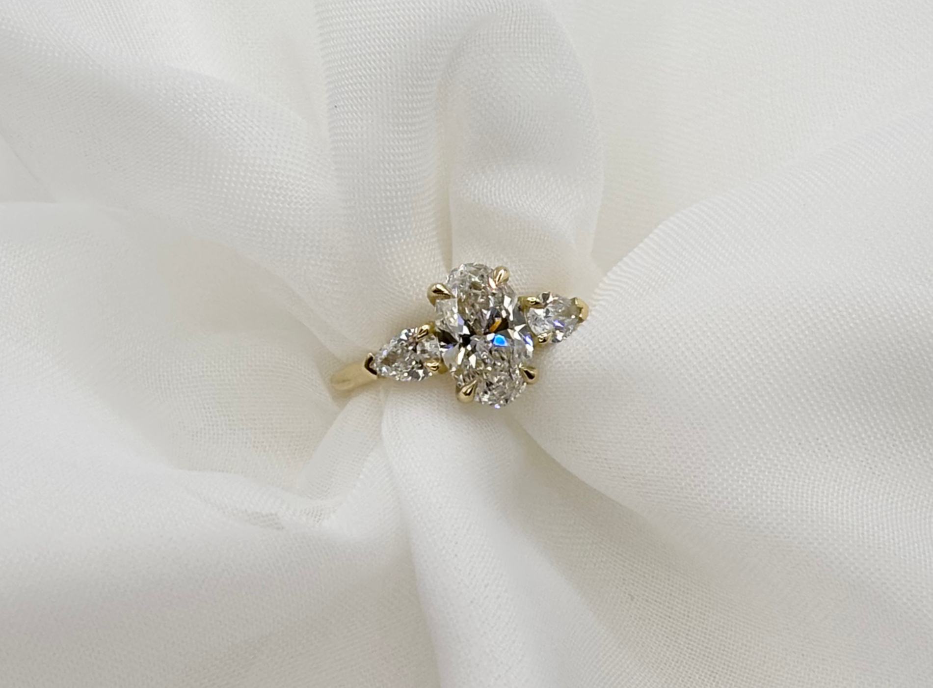 The final handcrafted bespoke jewellery piece showcasing intricate gold work and brilliant diamonds.