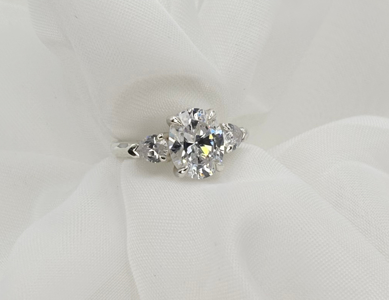 The initial silver mockup ring used to test comfort and fit during the design process.