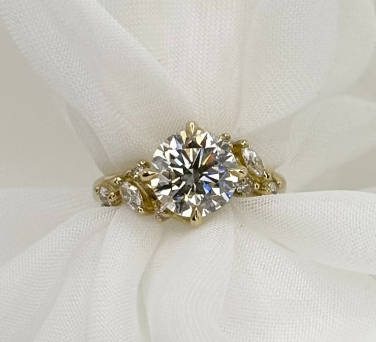 A sapphire and diamond engagement ring representing the clarity and depth of a clear night sky.