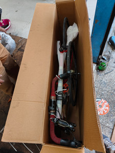 bicycle folded and packed in cardboard box