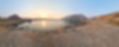 serene and peaceful lake at sunrise surrounded by cliffs