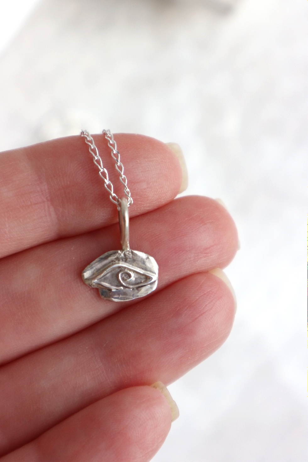 Close up showing details of silver Evil Eye Necklace