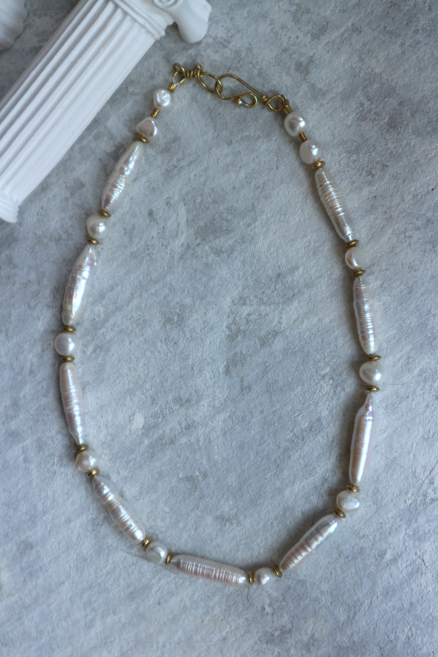 Flatlay of pearl necklace