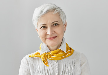 Beauty, style, fashion and aging concept. Charming elegant gray haired retired woman weari
