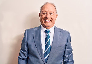 Senior handsome grey-haired businessman wearing elegant suit over white background with a 