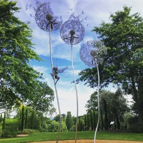 Giant Dandelion Sculpture with Fairy located in country park.