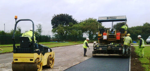 Road surfacing in progress by Johnson Surfacing - Playgrounds and Sports Court Surfacing