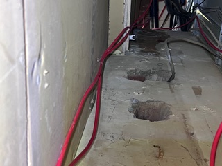 Larger view of a ceiling void showing the complexity of services and the difficulty in maintaining compartmentation without proper inspection and control.