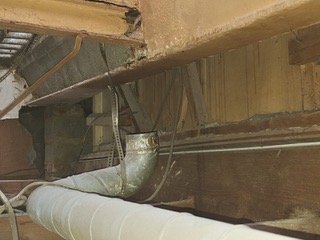 Ceiling void containing multiple services with little or no effective fire stopping. These hidden spaces can allow fire to travel unseen through a building.