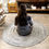 Thumbnail: Woman sits on round recycled mat