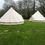 Thumbnail: Two bell tents on grassy field