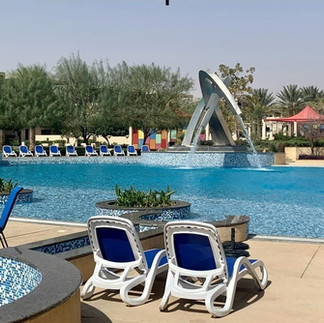 sun lounger and swimming pool