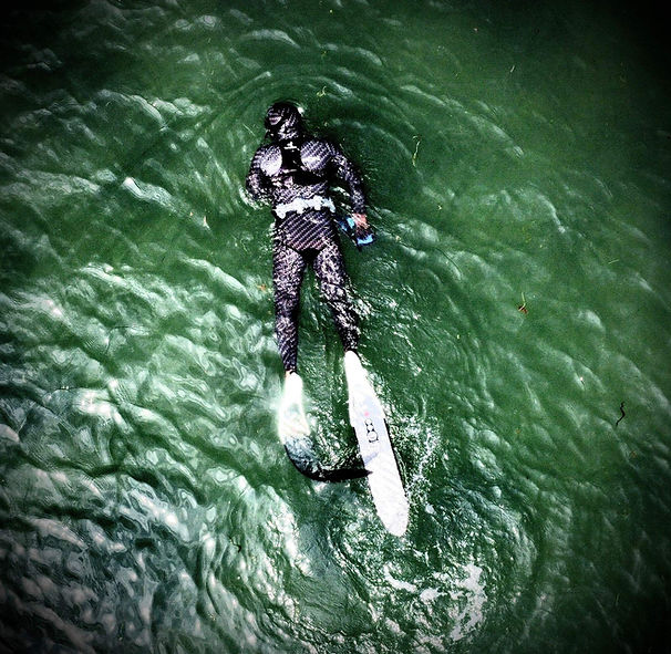 team diver spearfishing in the murky waters of cornwall trying to catch his dinner