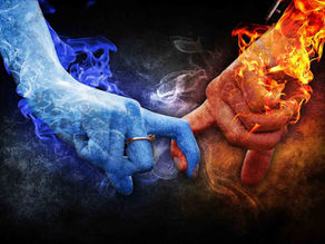 Two hands intertwined, one icy blue with mist, the other fiery red with flames, against a dark background, symbolizing contrast and unity.