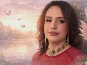 Woman in red dress gazes calmly at the viewer, with a serene lake and butterflies in the sunset background. Elegant jewelry adorns her.