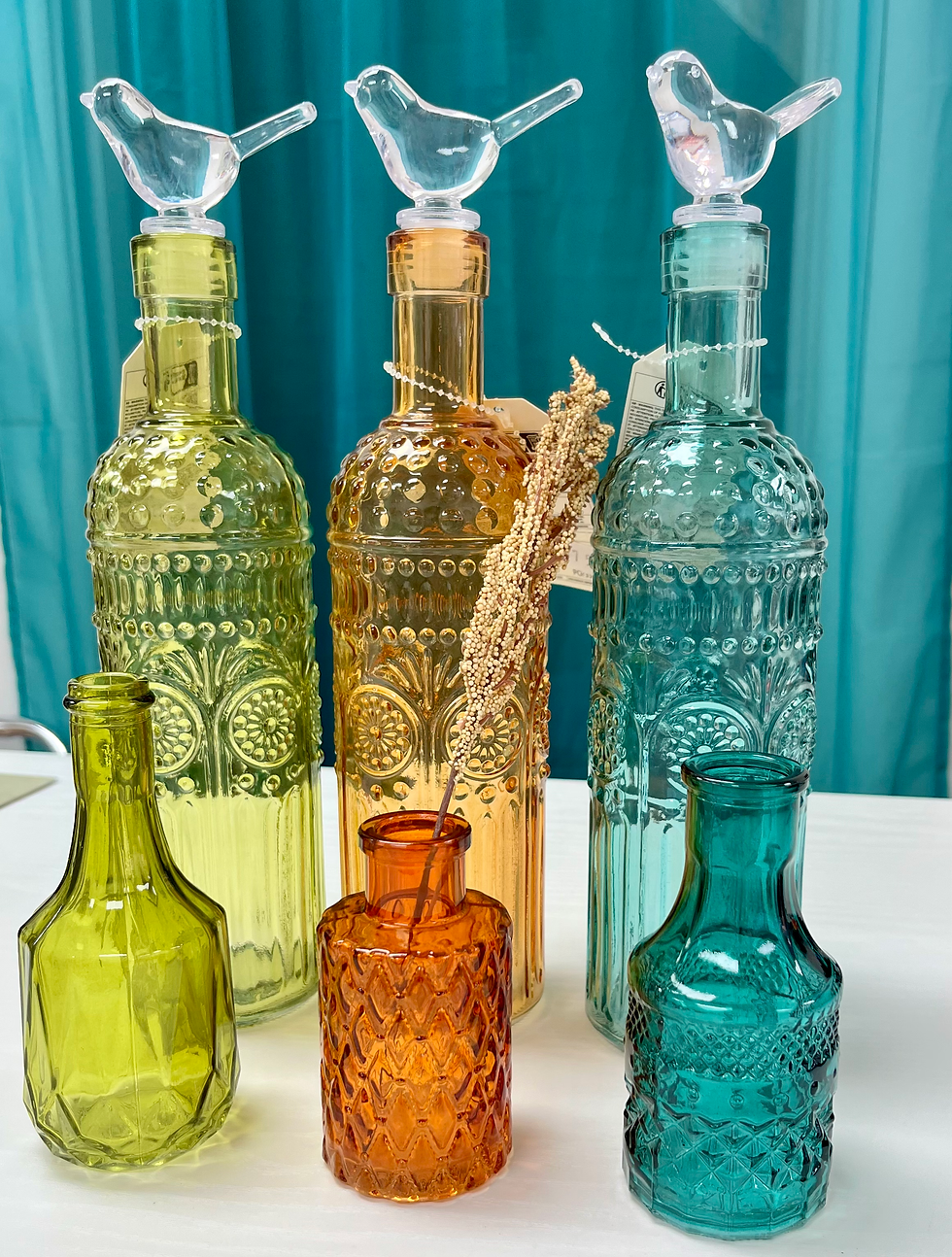 Thumbnail: Glass Bottles with Bird Stopper