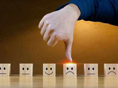 A thumb pointing down at a sad faced square