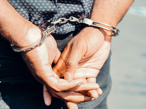 A piracy site worker being arrested for stealing books