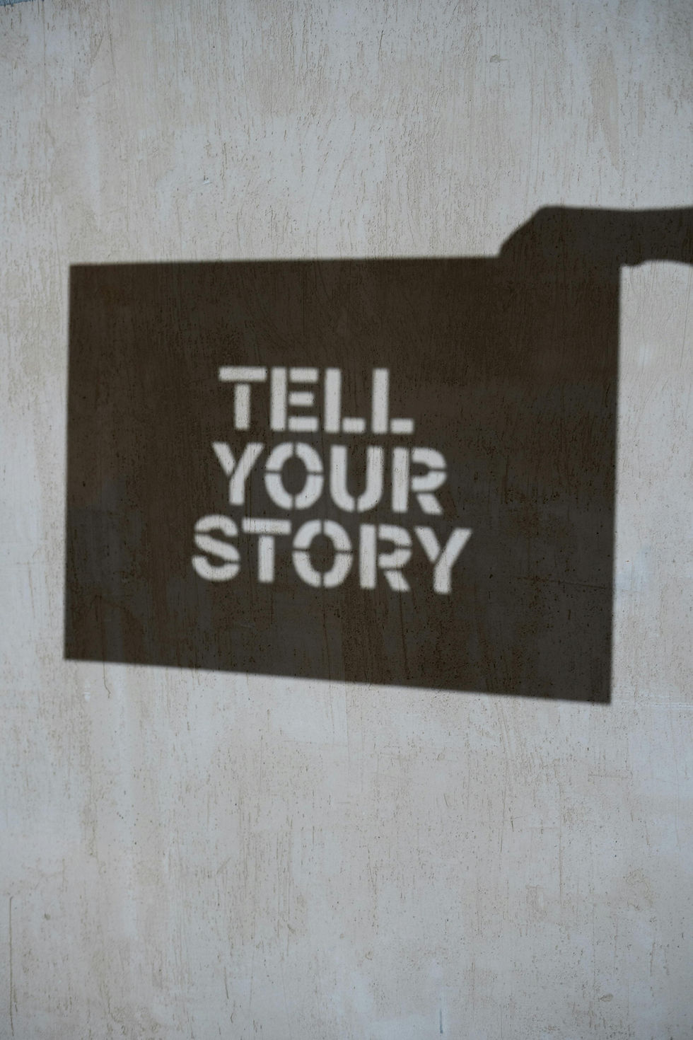 A sign that says tell your story