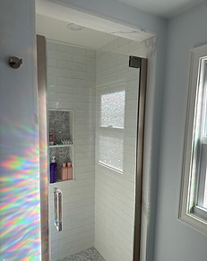Walk-In Shower Remodel with Built-In Shelving