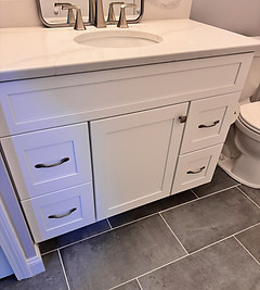Bathroom Remodel with White Vanity and Large Tile Flooring
