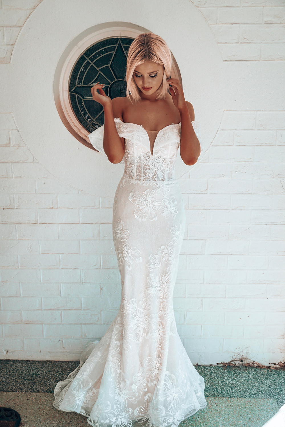 Chloe by Rachel Rose. Wedding dress suggestion for hourglass shaped bride. Off shoulder mermaid cut with floral detail.