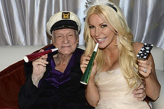 Hugh Hefner poses with his bride Crystal Harris