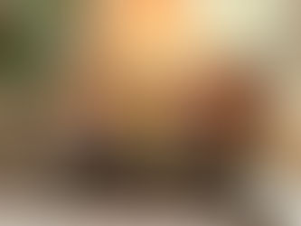 Tarot cards featuring Temperance, Death, and 10 of Pentacles on a table with crystals. Bright, colorful designs and a glowing background.