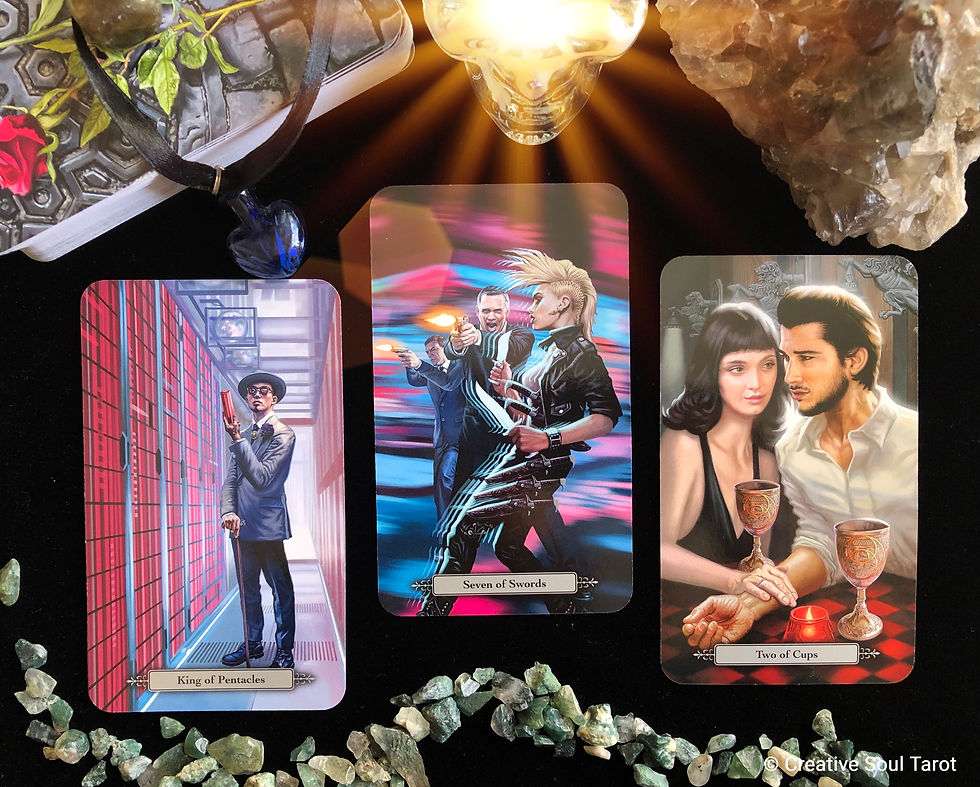 Tarot cards on a black cloth with crystals and a skull candle