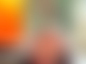 The Wheel of Fortune Tarot Card. A woman balances on red disks labeled "TAROT" in a mystical sky. Bright orange light shines, with crystals and star designs below.