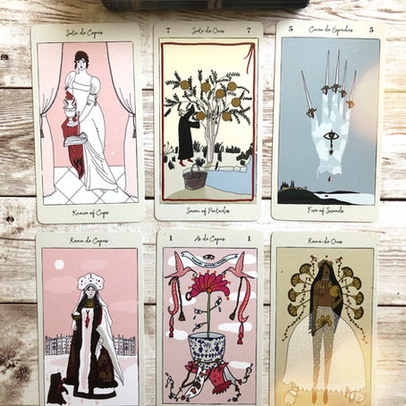 Tarot cards on a wooden table. Tarot de Carlotydes