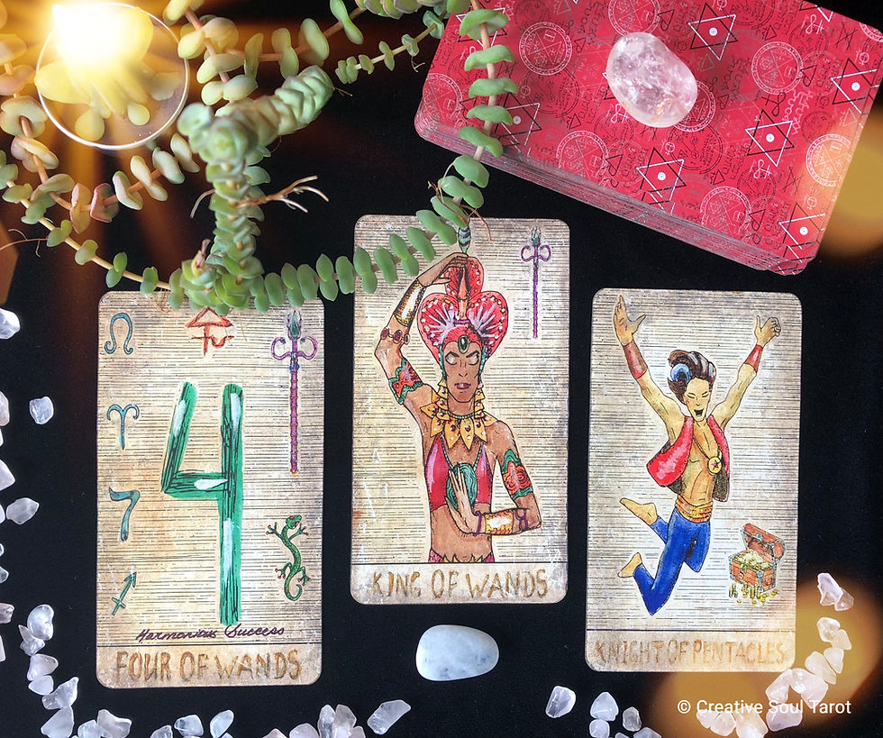 Tarot cards on a black cloth with a plant, candle, and crystals